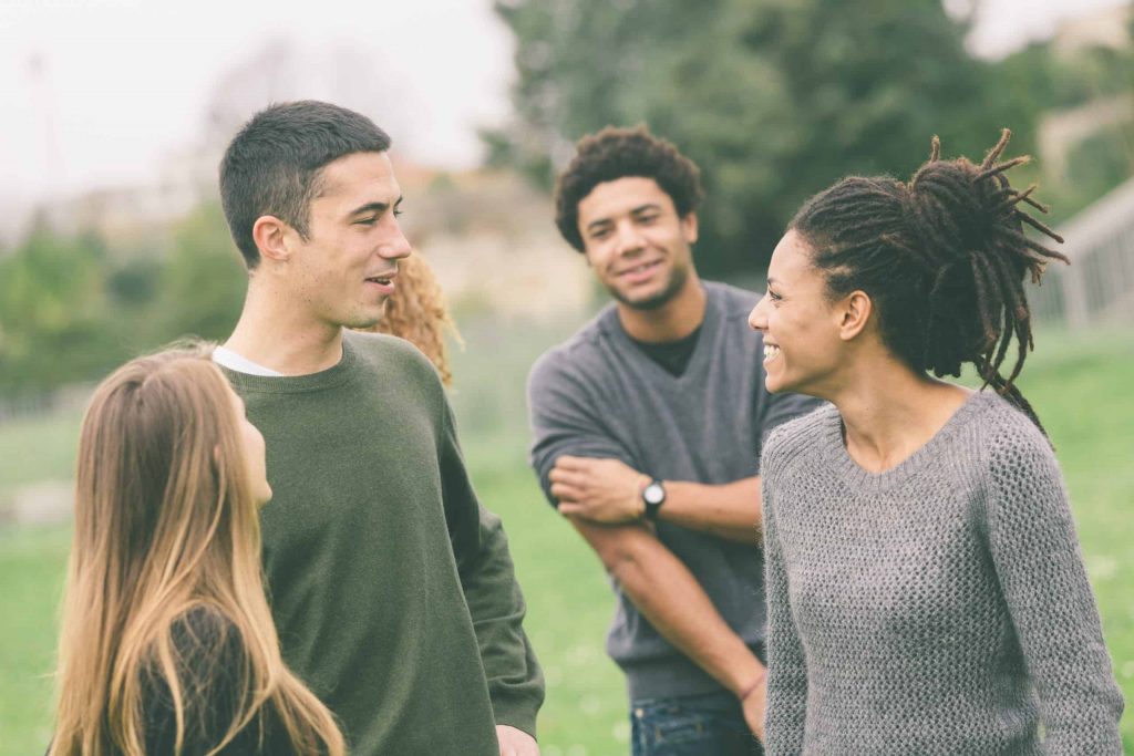 group of young adults talking
